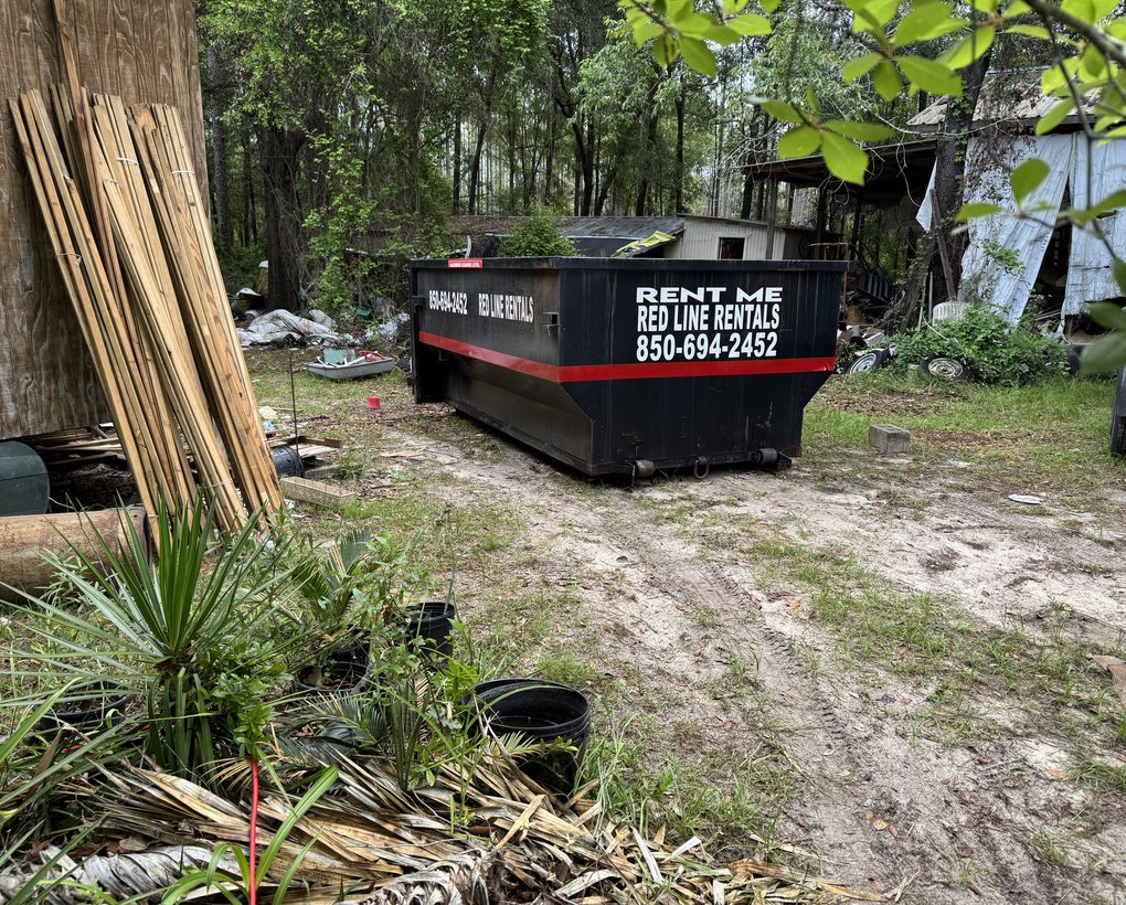Red Line Rentals roll-off dumpster during a home cleanout