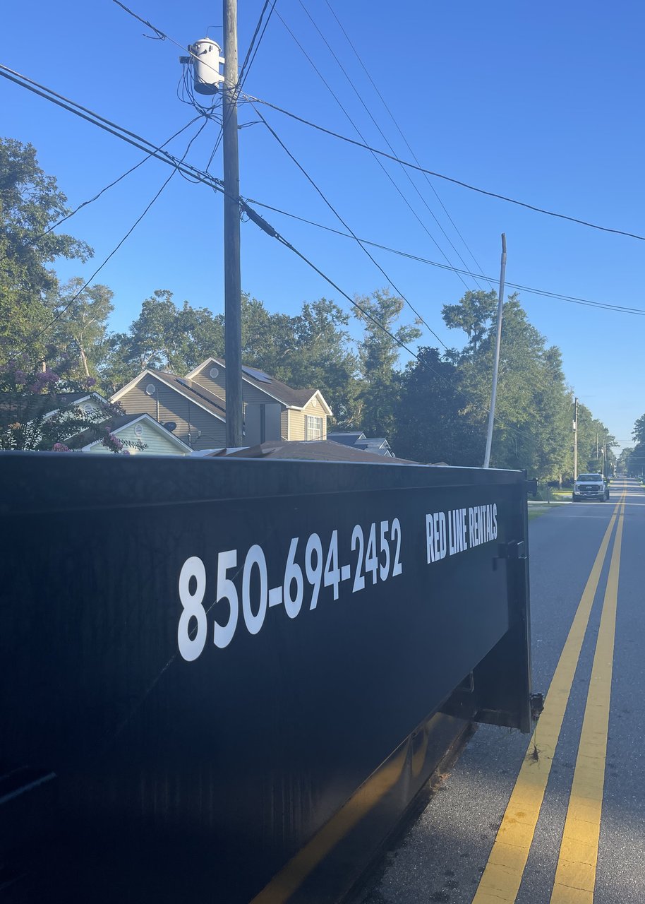 Red Line Rentals roll-off dumpster delivered to a Crawfordville, FL home