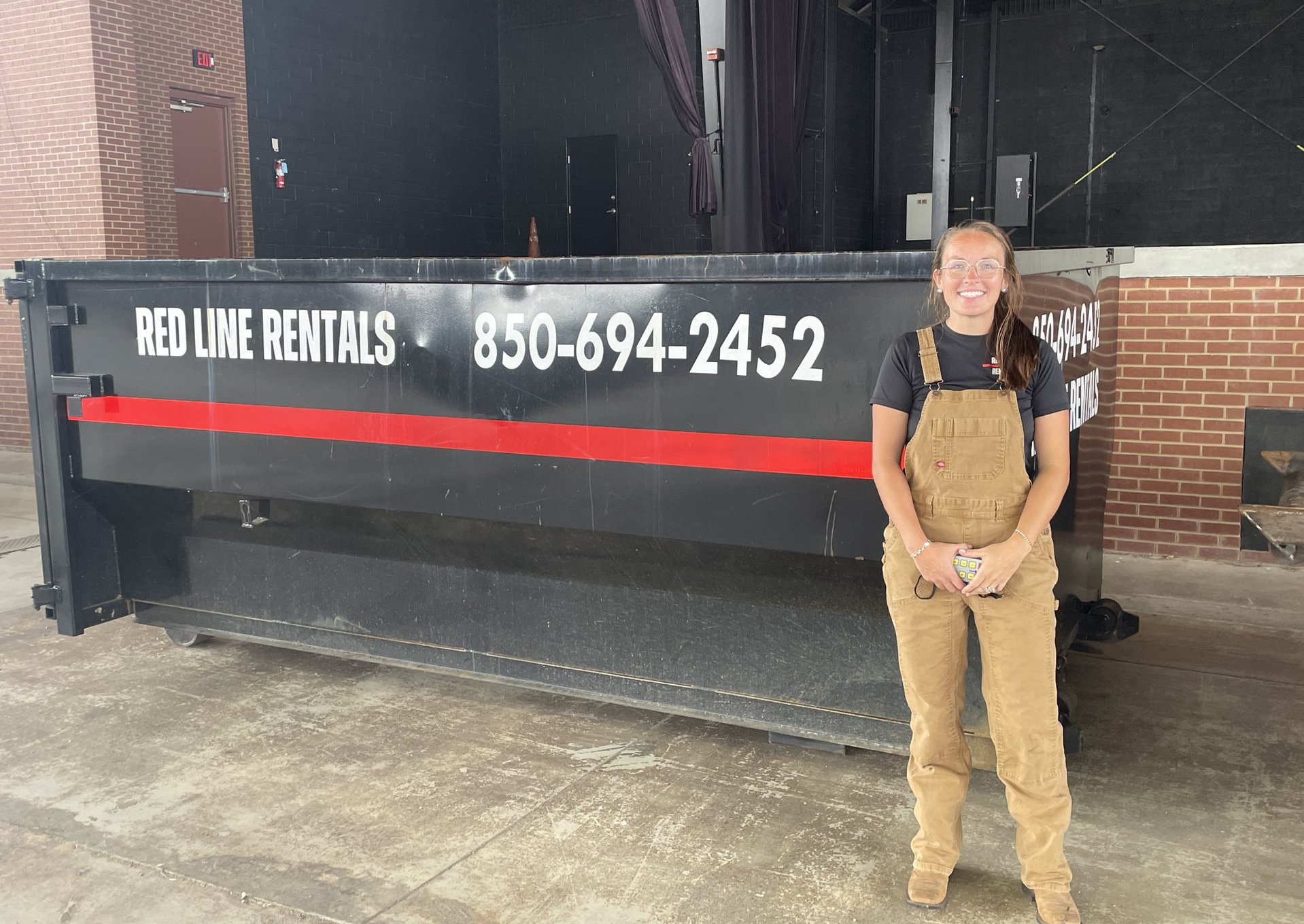 Red Line Rentals roll-off dumpster on a residential job site in Wakulla County, FL