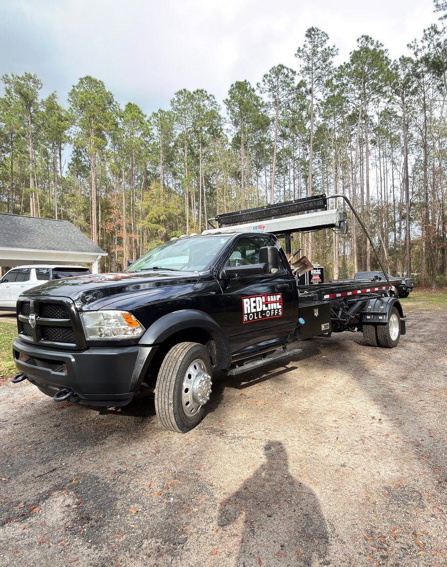Red Line Rentals roll-off dumpster delivered to a Crawfordville, FL home