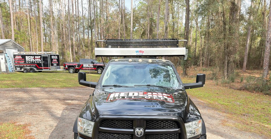 Red Line Rentals dump trailer and roll-off dumpster during a cleanout at a raised coastal home